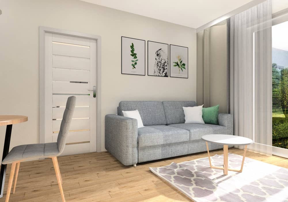 Salon w mieszkaniu 50 m2, widok na ścianę z sofą